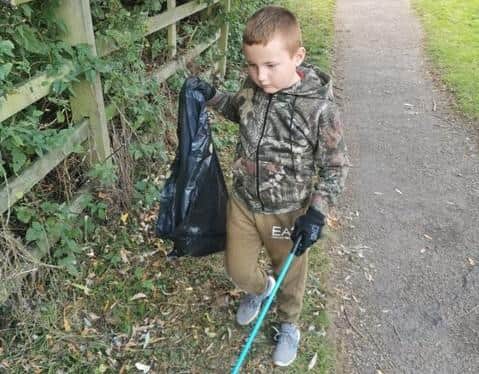 Over an hour-and-a-half Reuben and dad Robert found, beer cans, magazines, McDonald’s packaging and old clothes - filling a bin-liner
