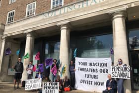 Extinction Rebellion campaigners shouting from the public gallery at the Nottinghamshire County Council meeting.