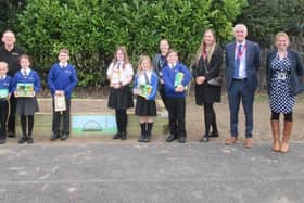 Staff and pupils at Serlby Park Academy pictured with Neill Lester and Annie Renhard from Premier Rail.