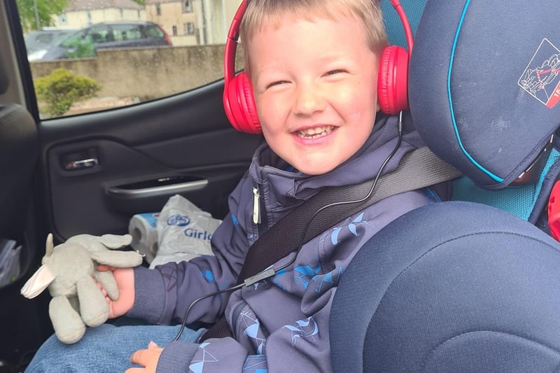 Lauryn McDonald's son is pictured testing his new earphones.