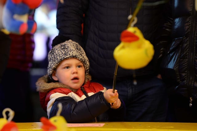 Frankie Osborne, aged three, playing hook a duck at After Dark at Don Valley Bowl, Sheffield in 2018