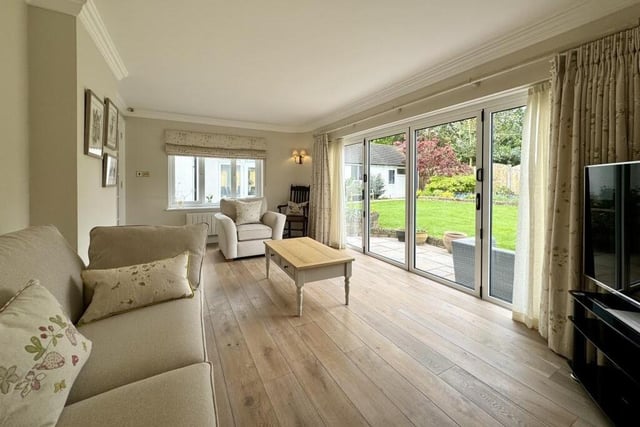 A charming addition to the £600,000-plus property is this sun room or garden room. It features lime, washed oak flooring, along with bi-folding doors that open on to a terrace and a lawn beyond in the back garden.