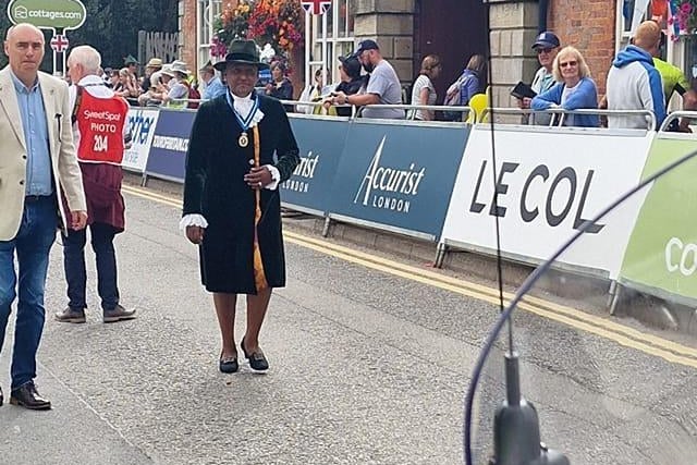 Spectators watch on in Edwinstowe as the High Sheriff of Nottinghamshire attends the race.