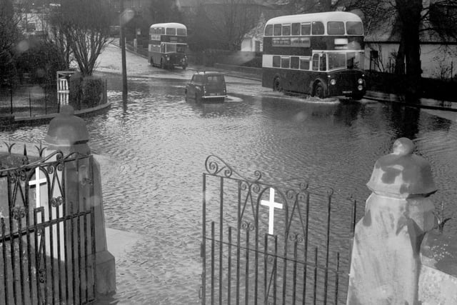 The road is flooded after a water main burst in Craiglockhart Drive in November 1965.