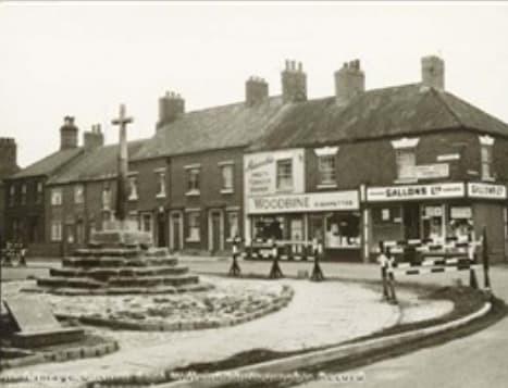 This picture, dating from the 1950s, shows shops at the junction of Potter Street and Priorswell Road. It was taken when the road had just been realigned. Previously the road (Abbey Street) ran through the arch of the Priory Gatehouse.