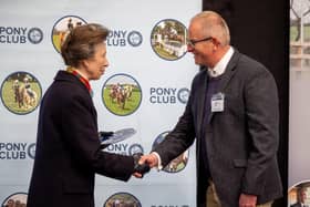Andrew Stennett receiving the Pony Club’s 25th Anniversary plaque from Princess Anne.