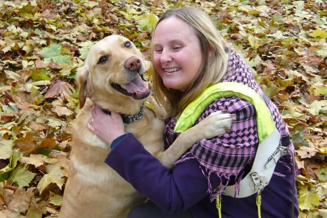 Julie Scarle, with guide dog Elsa, says disability rights have been put back 50 years by the pandemic