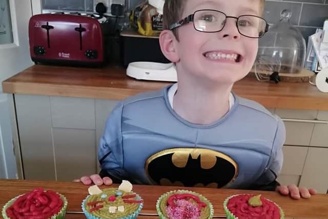 Finley Goulder, 6, with Finley's Fun Cakes -  almond flavour cupcakes decorated with 'any old rubbish' he and mum could find in the baking cupboard.