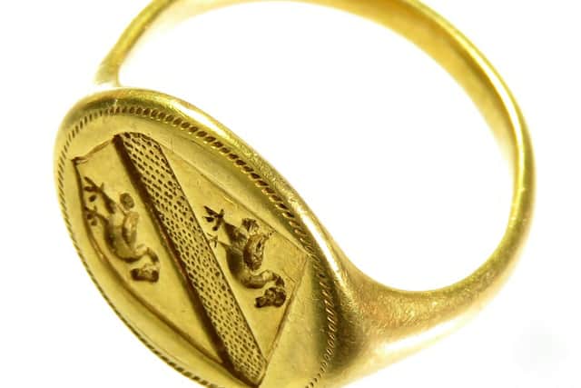 The 350-year-old gold ring displays the coat of arms of the Jenison family.  A find legendary outlaw Robin Hood would have loved to have made has been unearthed by a metal detectorist – the Sheriff of Nottingham’s gold signet ring.