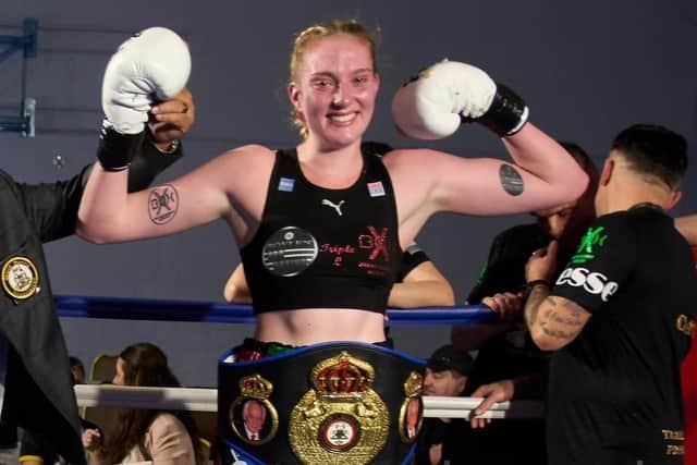 Delighted Ellie Coulson with her WBA middleweight belt.