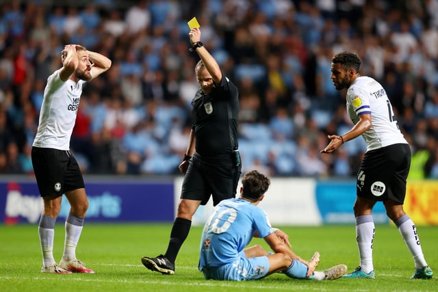 Referee Geoff Eltringham shows a yellow card to Dan Butler against Coventry City. Posh have had 80 bookings and two red cards this season.