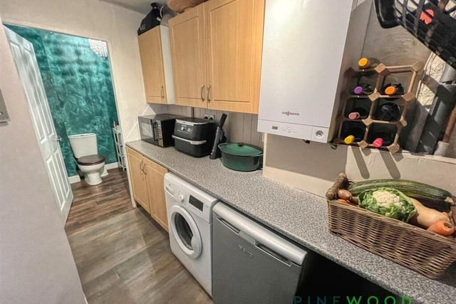 A useful utility room boasts plumbing for a washing machine, space for an under-counter fridge or freezer, storage units, a worktop and access to the downstairs WC and an integral garage.