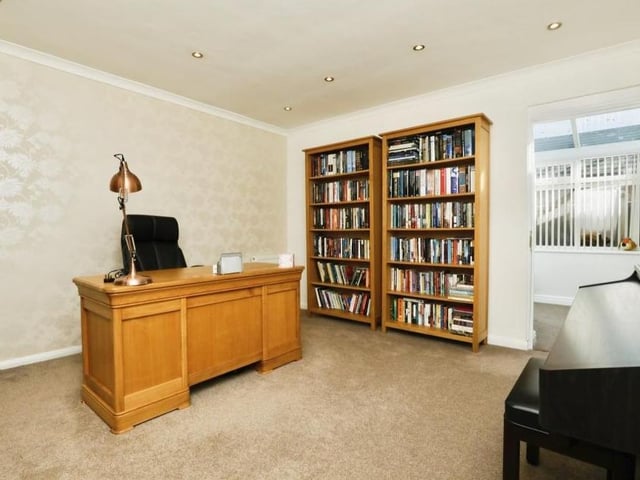Sandwiched between the lounge and the conservatory is this home office or study. It is a flexible space that has coving and spotlights to the ceiling. It also provides entry to the sun room.