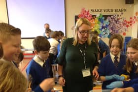 Staff from MBA Polymers UK, in Worksop, work with children at St John's Academy.