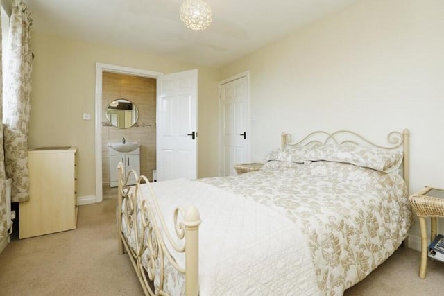 Let's move up to the first floor now and take a look at the main three bedrooms, starting with this master. A good size, it faces the front of the property and has access to an en suite shower room.