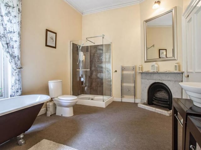 Here is the excellent en suite to the master bedroom. It includes his and hers sinks, bidet, roll-top bath and separate shower.