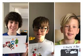 Harry, George, and Charlie with their initial book cover designs.