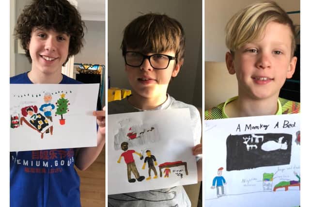 Harry, George, and Charlie with their initial book cover designs.