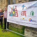 Handing over to contractor Pinnacle for the spire work at St John's Church, Worksop. Phil Kicks church project manager hands over to Alfie Spencer project manager for Pinnacle. left  John Hodgkins, Sue Dawson and Jack.