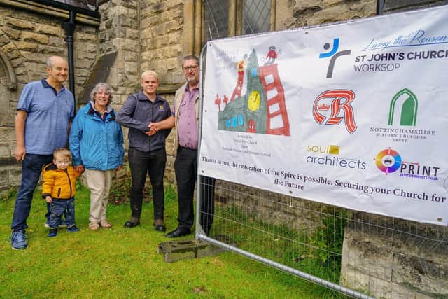 Handing over to contractor Pinnacle for the spire work at St John's Church, Worksop. Phil Kicks church project manager hands over to Alfie Spencer project manager for Pinnacle. left  John Hodgkins, Sue Dawson and Jack.