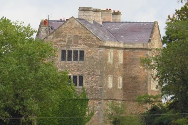 Dating from 1590, the building was probably originally a hunting lodge, it has been much altered. The house is in stone on a chamfered plinth, with quoins, moulded floor bands, moulded eaves, a parapet and a stone slate roof.