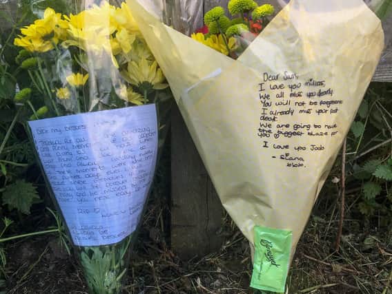 Floral tributes left after a male drowned at Ulley Country Park