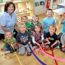 Treetops Nursery, Celtic Point, Worksop. Nursery held a May Pole event for the children teaching them the origins of the May Day celebrations. Picture: Nursery children with Mandy Brown and Becky Warnes. May 7, 2010.