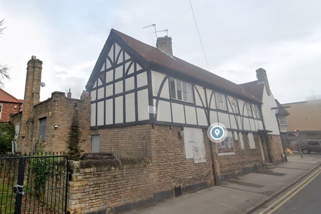 Dating from 1525, the inn, on a corner site, was extended to the rear in 1938. It is timber framed and rendered, with pantile roofs. The building is currently closed.