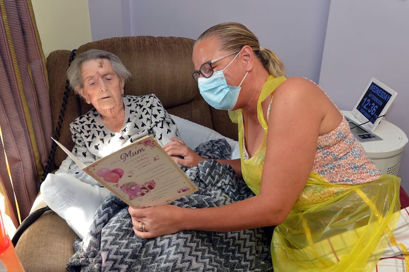 Selston Wren Hall nursing home feature. Dawn Bradshaw reading birthday cards to birthday girl Jean Gregory.