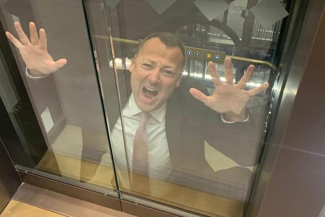 Brendan Clarke-Smith hilariously posed after the lift got lodged in between two floors.