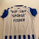 A Sheffield Wednesday shirt dedicated to Sam Fisher, the reverse of which has been signed by all the Owls players
