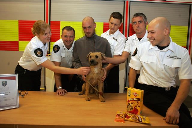 Pictured are mansfield Road Firefighters with Mac the dog in 2007