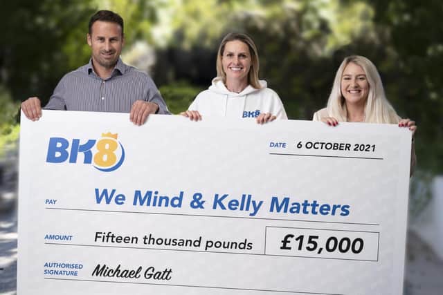 Presenting a previous donation to the charity is BK8 European Managing Director Michael Gatt with We Mind & Kelly Matters patron Kelly Smith ,centre, and Amy Hewitt from the charity.