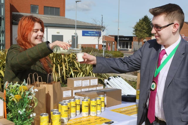 Bassetlaw Youth Mayor Malachi Carroll tries a honey infused drink from Zzinga Cider's Emma Bassindale.