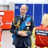 Prince Edward meets a couple of air ambulance paramedics at the charity's new headquarters.