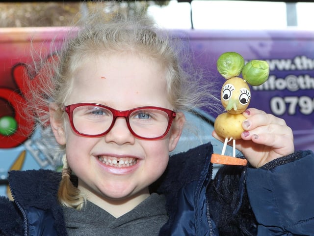Maisie Edwards, aged six, with her vegetable animal that she made at the food and drink show.