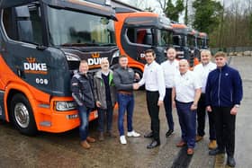 Dale Robinson, of Duke Distribution, has been handed the keys to five new Scania trucks by Chris Kelly, Keltruck chairman.