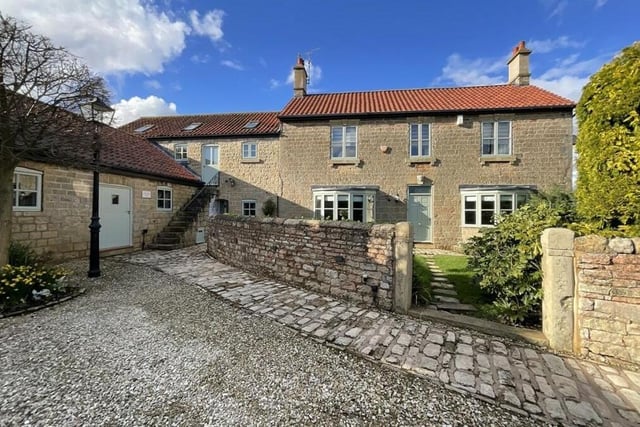 For the last photo in our gallery, let's return to the front of the Georgian farmhouse, where there is off-street parking space for five vehicles behind electric gates. See also the outdoor stone steps that lead up to the self-contained annexe.