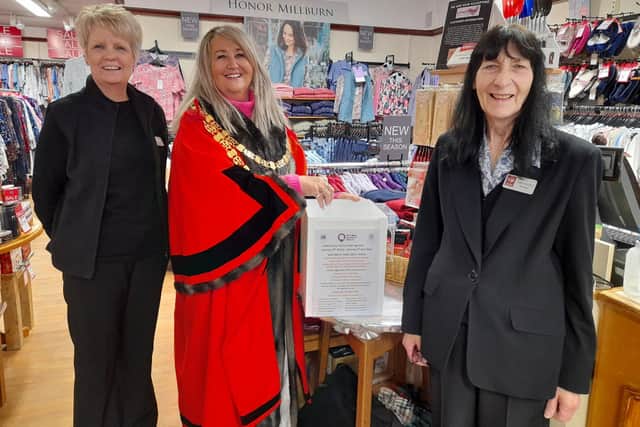 Retford Mayor,Councillor Sue Shaw is pictured drawing the winning entries helped by Julie and Ann from Edinburgh Woollen Mill