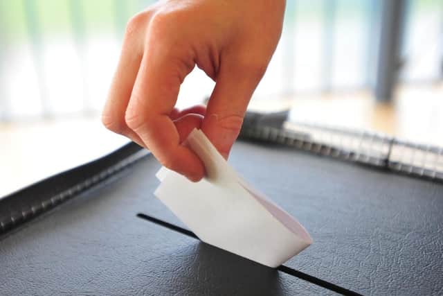Voters must now show photo ID before they can be given their ballot paper.