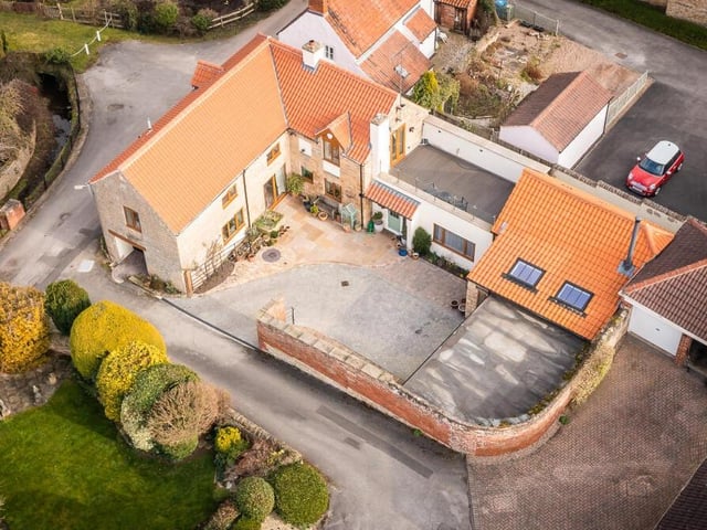 Here is a drone shot, giving an aerial overview of The Old Barn at Carlton in Lindrick. An appealing layout on a country lane.