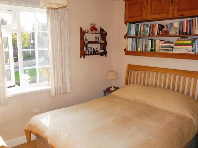 The main bedroom at the £200,000 cottage, which is on the first floor, overlooks the front of the property. It is a comfortable space, with a fitted carpet.
