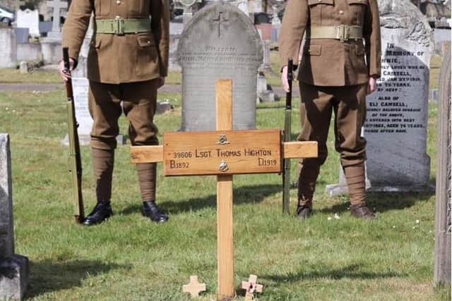 The cross when first installed, flanked by the two men in authentic Notts and Derby Regiment uniforms of 1918.