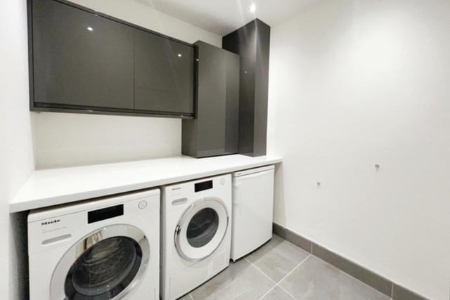 Just off the kitchen is a useful utility room, where there is space for free-standing appliances such as a washing machine and tumble dryer. There is also a range of wall units and work surfaces, as well as a wall-mounted condensed boiler, set behind matching cupboard fronts.