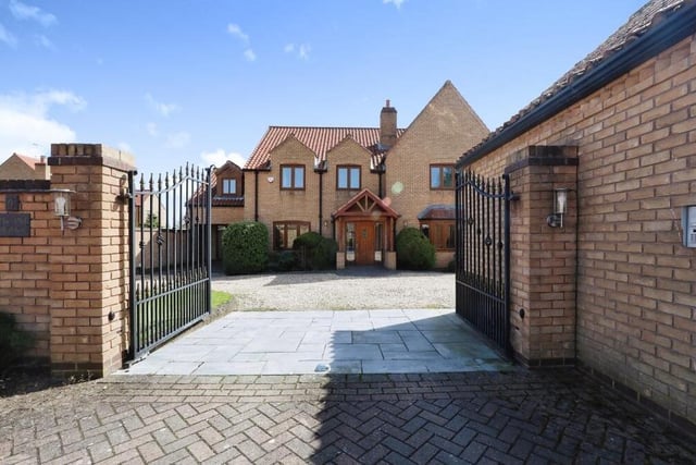 Back to the front of the £660,000 Carlton in Lindrick house now. These electric gates, complete with intercom system for security, open on to a sizeable driveway that offers space for off-street parking.
