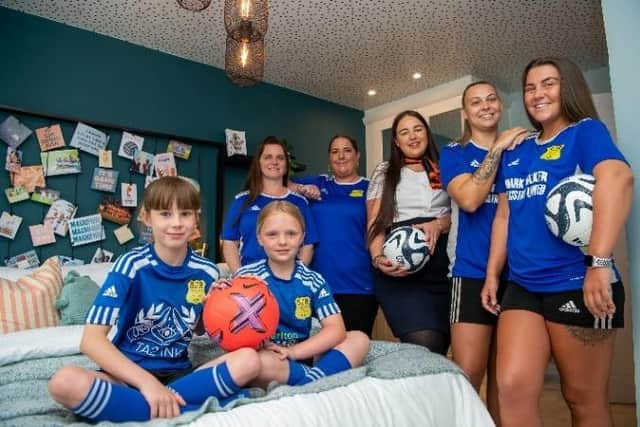 Women and girls from SJR Worksop FC enjoy viewing the Lionesses-inspired bedroom in the Spinner show home at Bellway’s Gateford Quarter development in Worksop.