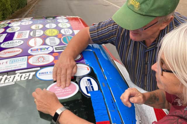 A sticker remembering Lily Madine as 'one L of a lady' has been placed on Stuart Dixon's Jaguar as he raises money for Bluebell Wood.