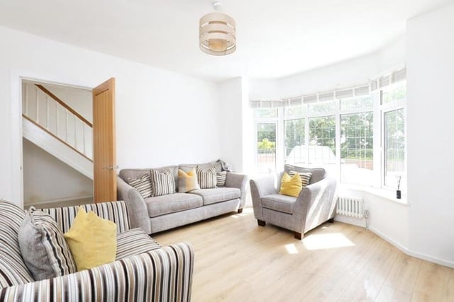 The traditional lounge is bright and light thanks to a front-facing, double-glazed bay window. The room also features a central chimney breast, wood flooring and a cast-iron central-heating radiator.