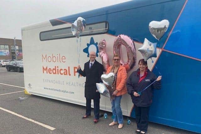 (L-R): Clinical Director of South Yorkshire and Bassetlaw Lung Cancer Screening Dr Jason Page, lung cancer survivor Sandra Sloan, and AML Mobile Manager Dawn Baldwin in front of one of the scanning units at a celebratory event to mark 50 cancers being detected in Doncaster patients, in March 2022