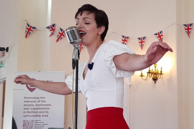 Jessica Mary Brett performing at the Coronation celebration at  Retford Town Hall. The event was planned and delivered by Retford Business Forum (RBF) in
partnership with North Notts BID, Bassetlaw District Council, and Retford Charter Trustees.